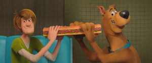 Samy et Scooby s'apprêtent à manger un énorme sandwich.