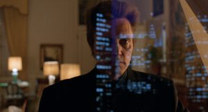 Christopher Walken observe New-York de nuit, de son bureau, derrière une vitre sur laquelle se reflète la ville ; plan issu du film The King of New-York.