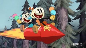 Mugman et Cuphead tout joyeux sur un missile rouge en flammes, à travers la forêt ; scène de la série The Cuphead show.