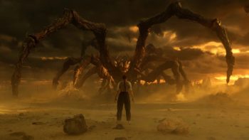 Un homme vu de dos fait face à une immense araignée géante dans la saison 5 de Stranger Things.